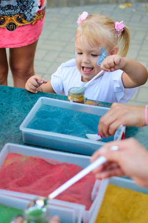 Alchevsk, Ukraine - August 17, 2017: Happy children play with animators in summer.のeditorial素材