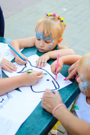 Alchevsk, Ukraine - August 17, 2017: Happy children play with animators in summer.のeditorial素材