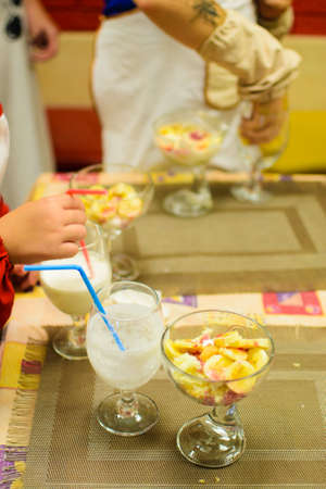 children prepare a cocktail of raw ingredientsの写真素材