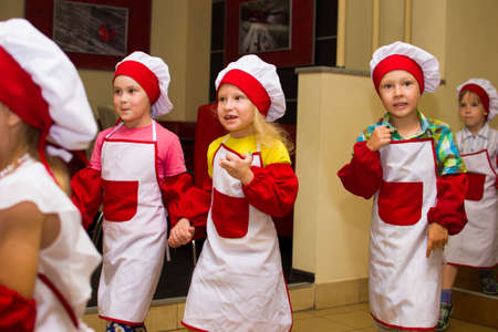 Alchevsk, Ukraine - July 23, 2017: School cook for children. Active games with children in the form of cooks.のeditorial素材