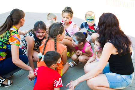 Alchevsk, Ukraine - July 27, 2017: Happy children play with animators in summer -のeditorial素材