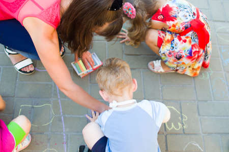 Alchevsk, Ukraine - August 3, 2017: Children draw chalk on the asphalt-のeditorial素材