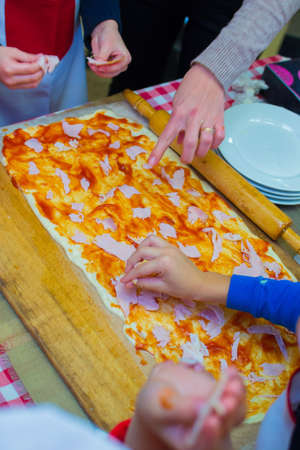 cooking a large rectangular pizzaの写真素材