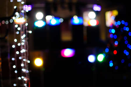 Multicolored shiny and bokeh dark background, abstract