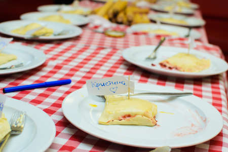 children cook a cheese patty with their own hands.の写真素材