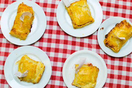 children cook a cheese patty with their own hands.の写真素材