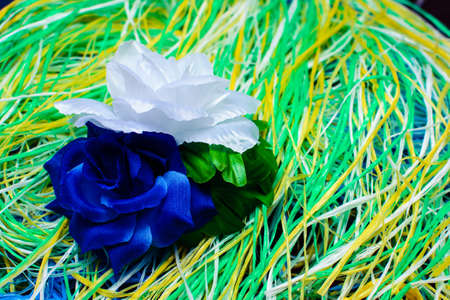 artificial flower on a substrate of multi-colored thread.の写真素材