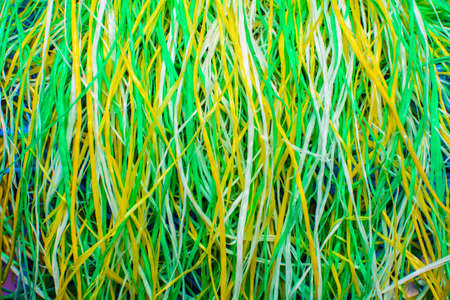 Multicolored knotted lace of thread. Abstract background color