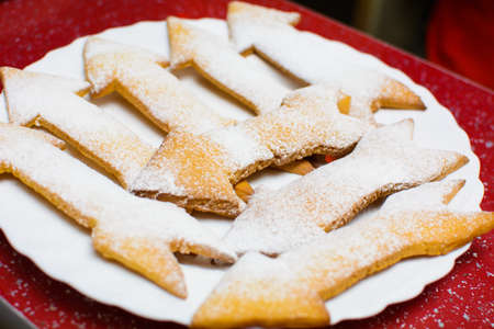 many cookies in the form of arrows on a plate.の写真素材