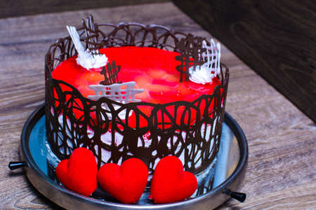 cake with red jelly and decorated with chocolate.の写真素材