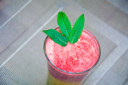multicolored smoothies decorated with mintの写真素材