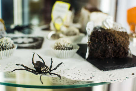 Desserts with paper figures of spiders in halloweenの写真素材