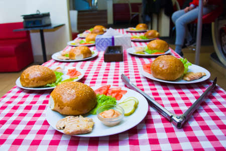 ingredients for making sandwiches with rolls on the table.の写真素材