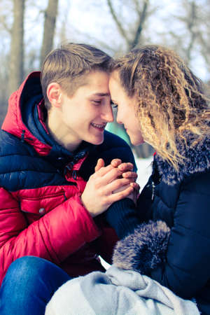 loving young couple in winter in park