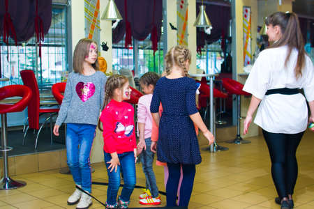 Alchevsk, Ukraine - October 27, 2018: children play with animators.のeditorial素材
