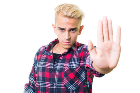 guy in shirt shows stop sign with his hand.の写真素材