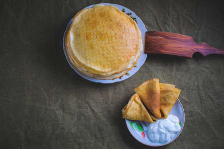 Shrovetide, traditional pancakes, homemade pastries with sour cream
