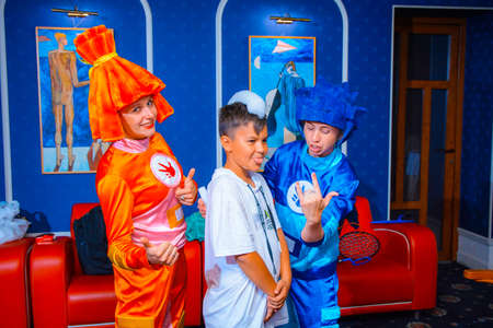 Alchevsk, Ukraine - September 14, 2020: children with an animator in a cafe play soap bubblesのeditorial素材