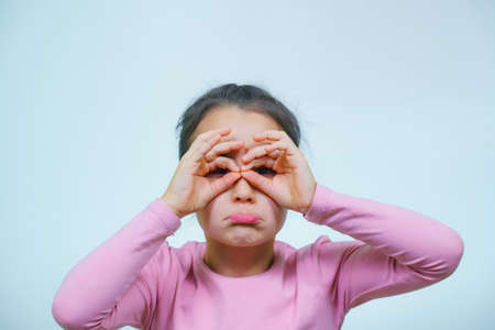 portrait of a girl who makes grimaces.の写真素材