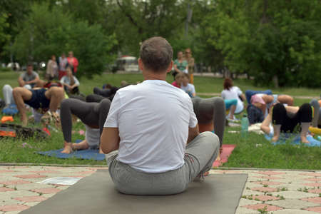 TOMSK RUSSIA - JUNE 19, 2016:: Residents of the city are taking part in the open lesson on Yogaのeditorial素材