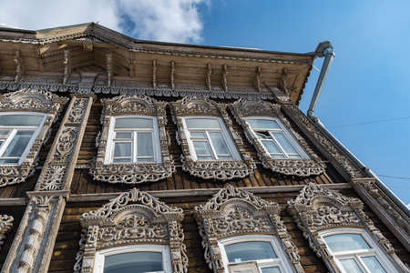 Tomsk, Russia - March 12, 2021. Wooden residential building on the street of the old district of Tomskのeditorial素材