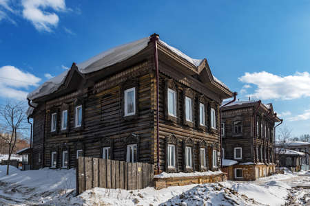 Tomsk, Russia - March 12, 2021. Wooden residential building on the street of the old district of Tomskのeditorial素材