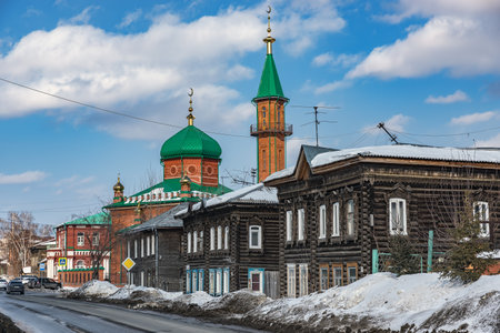 Tomsk, Russia - March 12, 2021. Wooden residential buildings on the street of the old district of Tomskのeditorial素材