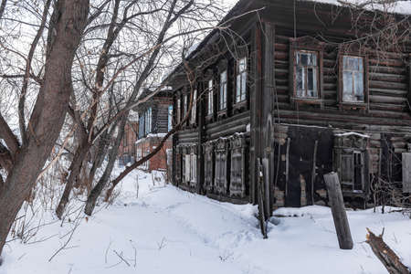 Tomsk, Russia - March 12, 2021. Wooden residential building on the street of the old district of Tomskのeditorial素材