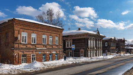 Tomsk, Russia - March 12, 2021. Wooden residential buildings on the street of the old district of Tomskのeditorial素材