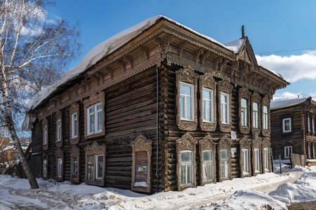 Tomsk, Russia - March 12, 2021. Wooden residential building on the street of the old district of Tomskのeditorial素材