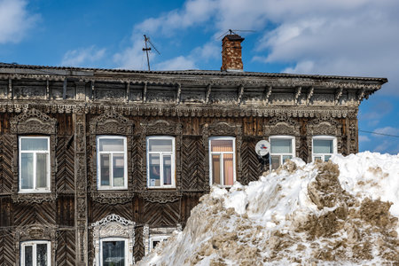 Tomsk, Russia - March 12, 2021. Wooden residential building on the street of the old district of Tomskのeditorial素材