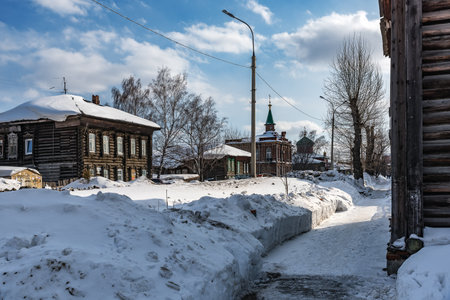Tomsk, Russia - March 12, 2021. Wooden residential buildings on the street of the old district of Tomskのeditorial素材