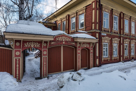 Tomsk, Russia - March 12, 2021. Wooden residential building on the street of the old district of Tomskのeditorial素材