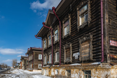 Tomsk, Russia - March 12, 2021. Wooden residential buildings on the street of the old district of Tomskのeditorial素材