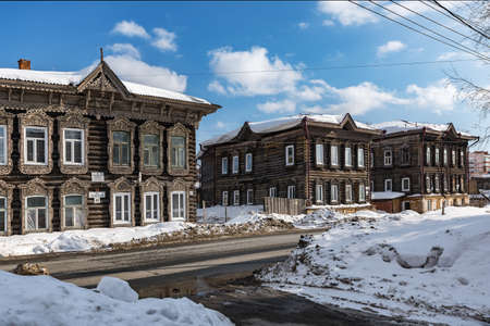 Tomsk, Russia - March 12, 2021. Wooden residential buildings on the street of the old district of Tomskのeditorial素材