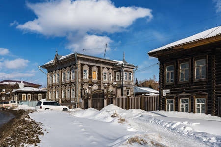 Tomsk, Russia - March 12, 2021. Wooden residential buildings on the street of the old district of Tomskのeditorial素材