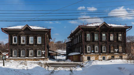Tomsk, Russia - March 12, 2021. Wooden residential buildings on the street of the old district of Tomskのeditorial素材