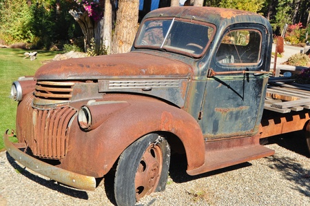 Rusty old flatbed truck used as decorationの写真素材