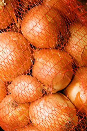 Ripe onion in a bagの写真素材