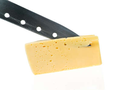 cheese piece with knife is reflected in a white backgroundの写真素材