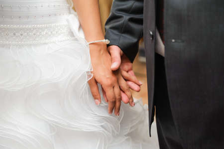 bride and groom to hold hands  togetherness couple and loving careの写真素材