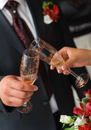 bride and groom a clink glasses  Wedding coupleの写真素材