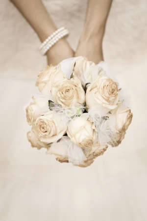 beauty wedding bouquet of roses in a bride hands  retro styleの写真素材