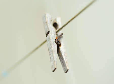old wooden clothespeg hanging on rope  Blur backgroundの写真素材