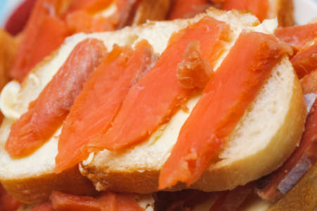 salted red pieces of fish on a bread  delicacy kosher foodの写真素材