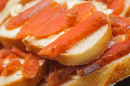 salted red pieces of fish on a bread  delicacy kosher foodの写真素材