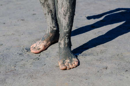 take a mud cure. healthy medical procedure. dirty legsの写真素材