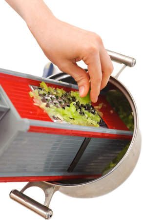 woman hands cutting green cucumber on a grater  Cooking foodの写真素材