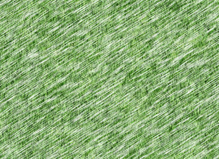 lush green grass texture under snowfallの写真素材