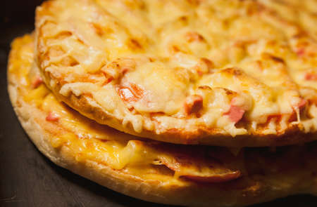 cooking cheese pizza in a hot ovenの写真素材